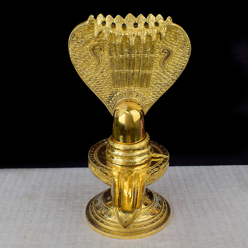 14.2 Inch Brass Shiva Ling with Nag Hood – A divine, intricately designed statue of Lord Shiva’s sacred Lingam with a Nag Hood. Perfect for Shivratri celebrations, worship, and enhancing your spiritual space. India’s Largest Pooja Accessories Brand – www.satvikworld.com
