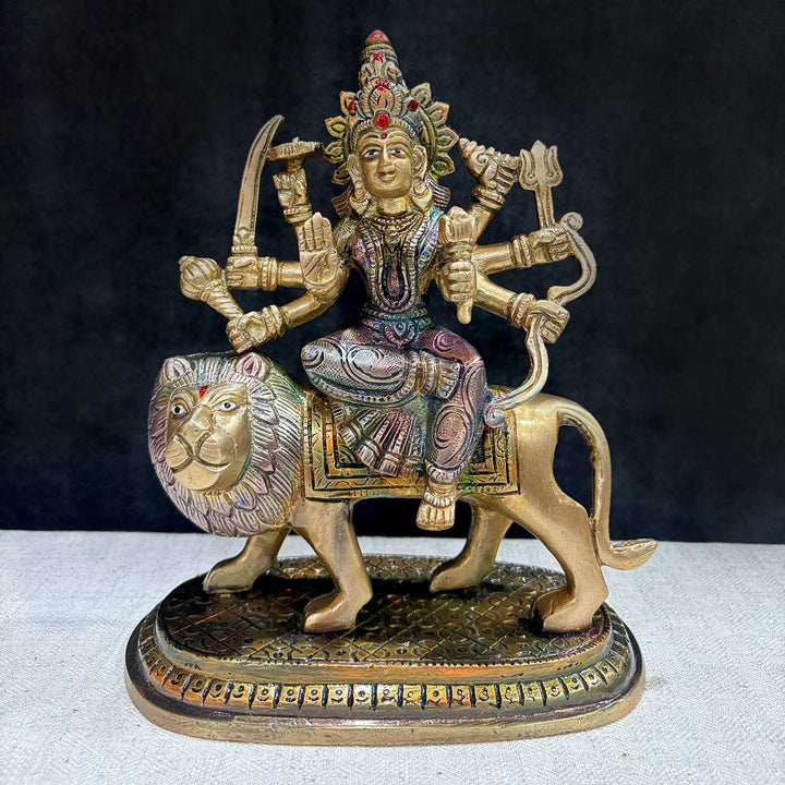 8.5 Inch Majestic Brass 8-Armed Maa Durga Idol on Lion, A Magnificent Representation of Goddess Durga with Eight Arms, Riding a Fierce Lion. Crafted from High-Quality Brass, This Idol Embodies Strength, Courage, and Divine Protection. Perfect for Pooja, Home, or Temple Décor, It Adds a Sacred Presence and Spiritual Energy to Your Sacred Space. India’s Largest Pooja Accessories Brand – www.satvikworld.com