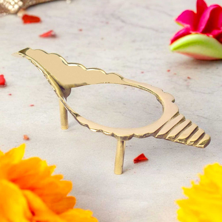 8 inch finely crafted brass Shankh stand with a sturdy base and traditional design, perfect for securely holding sacred conch shells in temples or home mandirs. India’s Largest Pooja Accessories Brand – www.satvikworld.com