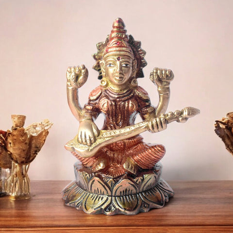 4.7-inch spiritual brass Goddess Saraswati statue, intricately crafted to symbolize wisdom, knowledge, and divine energy. Depicting her with her veena, the statue is perfect for worship, study spaces, or as a source of inspiration. India’s Largest Pooja Accessories Brand – www.satvikworld.com