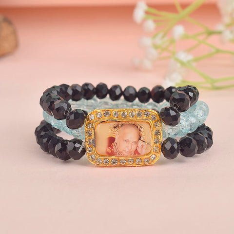 Black & Baby Blue Triple Layer Guruji Swaroop Bracelet featuring sleek black beads with soft baby blue middle layer and Jai Guruji Swaroop – perfect for spiritual wear, meditation, and gifting. India’s Largest Pooja Accessories Brand – www.satvikworld.com