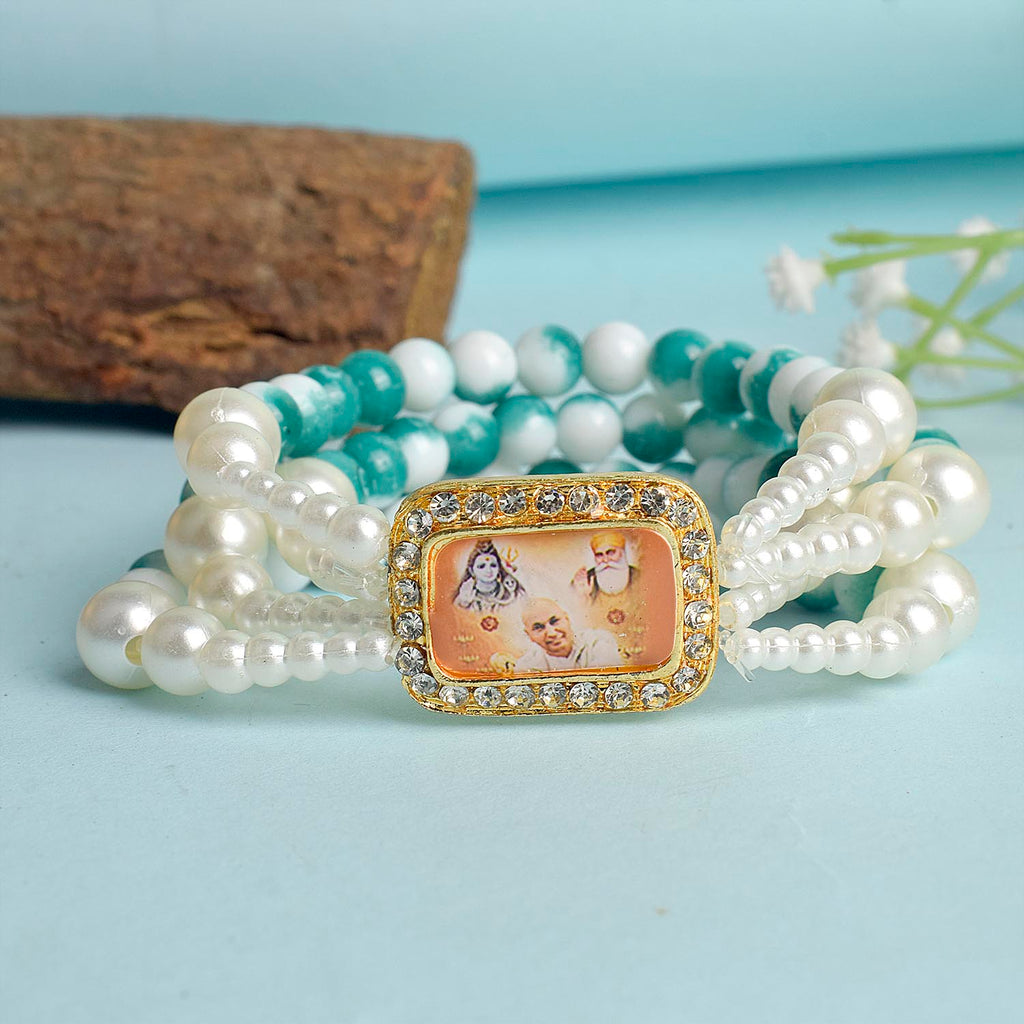 Bluish Green & White Marble Four Layer Guruji Swaroop Bracelet featuring tranquil bluish green beads and marble effect white beads with Jai Guruji Swaroop – perfect for spiritual wear, festive gifting, and daily devotion. India’s Largest Pooja Accessories Brand – www.satvikworld.com