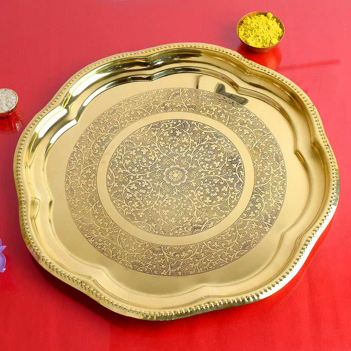 Brass decorative engraved aarti puja thali with traditional motifs and a golden finish for festive rituals. India’s Largest Pooja Accessories Brand – www.satvikworld.com

