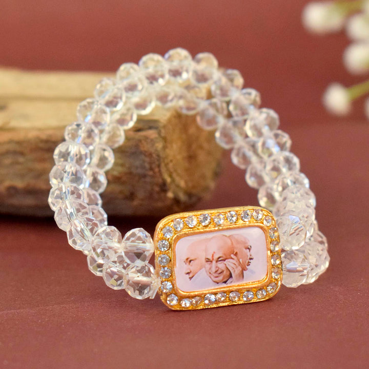 Clear Shiny Beads Single Layer Guruji Swaroop Bracelet featuring sparkling clear beads and Jai Guruji Swaroop – perfect for minimalist spiritual wear, meditation, and gifting. India’s Largest Pooja Accessories Brand – www.satvikworld.com