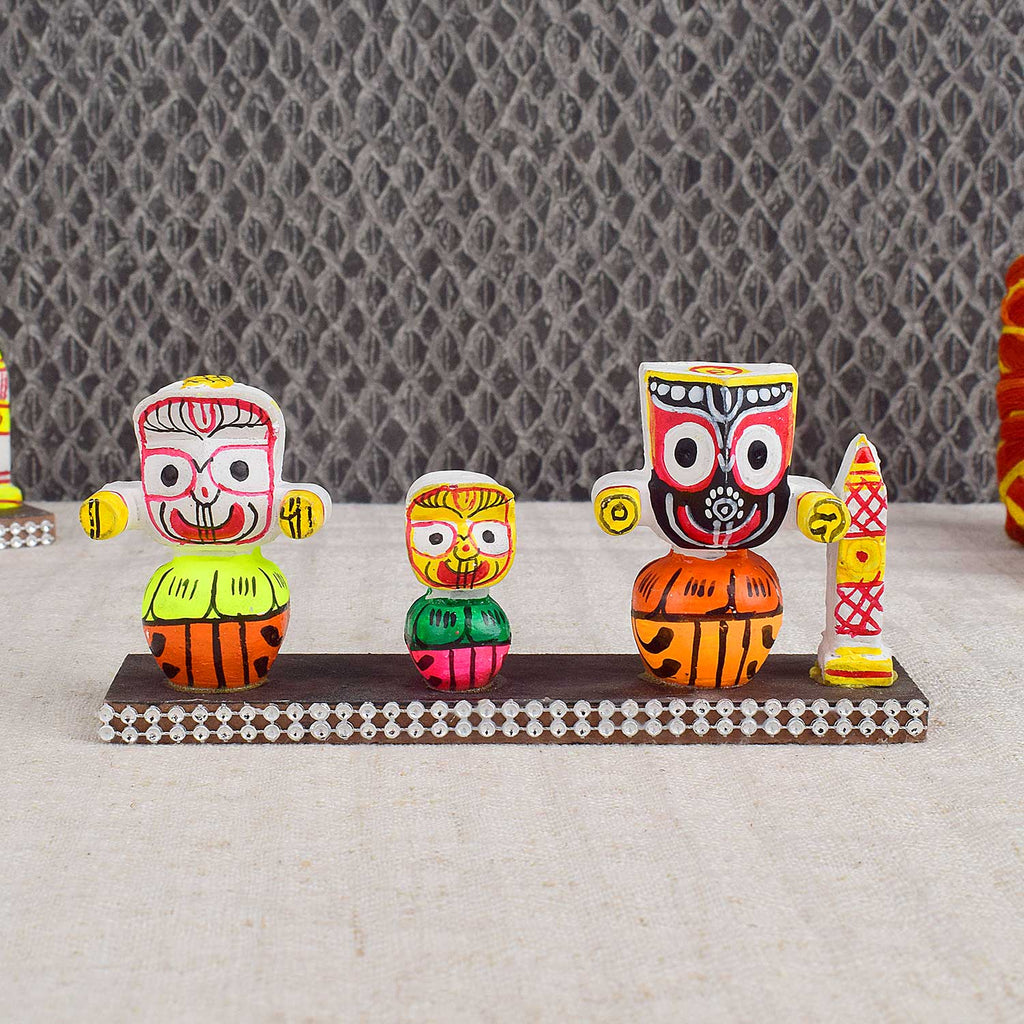Colorful Lord Jagannath idol in vibrant traditional attire, perfect for car dashboard or home altar, symbolizing protection, devotion, and travel blessings. India’s Largest Pooja Accessories Brand - www.satvikworld.com

