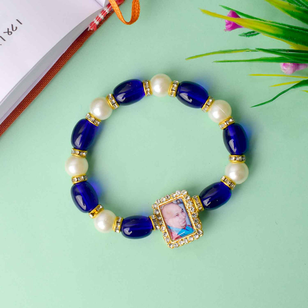 Elegant Guruji Swaroop Bracelet made with blue and white pearls for divine connection and spiritual elegance. India’s Largest Pooja Accessories Brand – www.satvikworld.com

