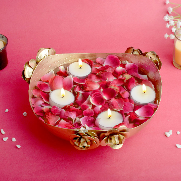Elegant gold-finished metal urli bowl with intricate floral design, ideal for floating candles, flowers, or festive home décor. India’s Largest Pooja Accessories Brand – www.satvikworld.com