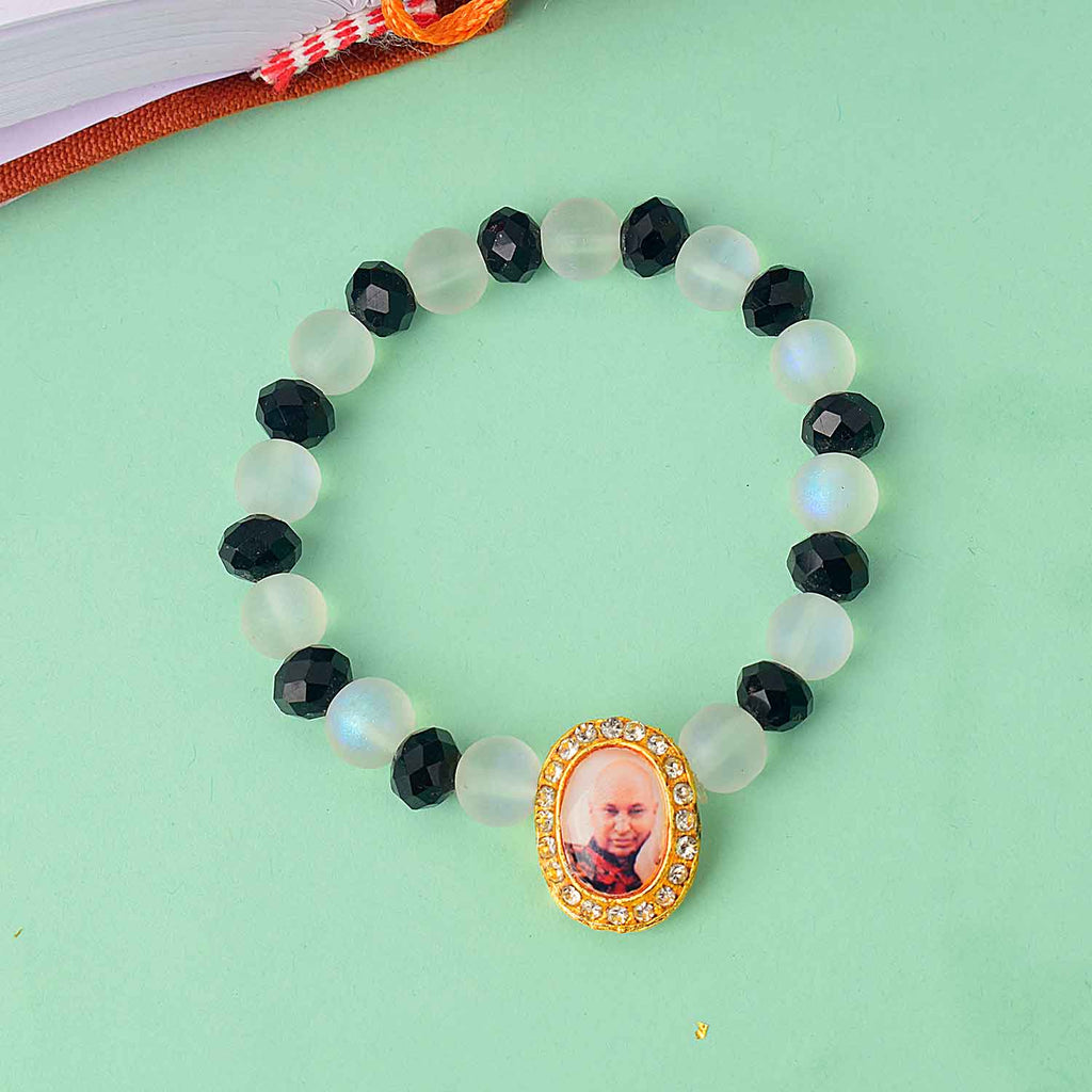 Guruji Swaroop Bracelet with elegant white and black beads – spiritual bracelet for pooja, gifting, satsangs, and daily wear. Satvikworld.com