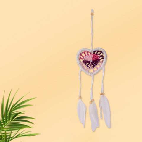 Heart-shaped handmade dream catcher wall hanging decorated with natural feather charms, ideal for bedroom and spiritual décor. India’s Largest Pooja Accessories Brand – www.satvikworld.com