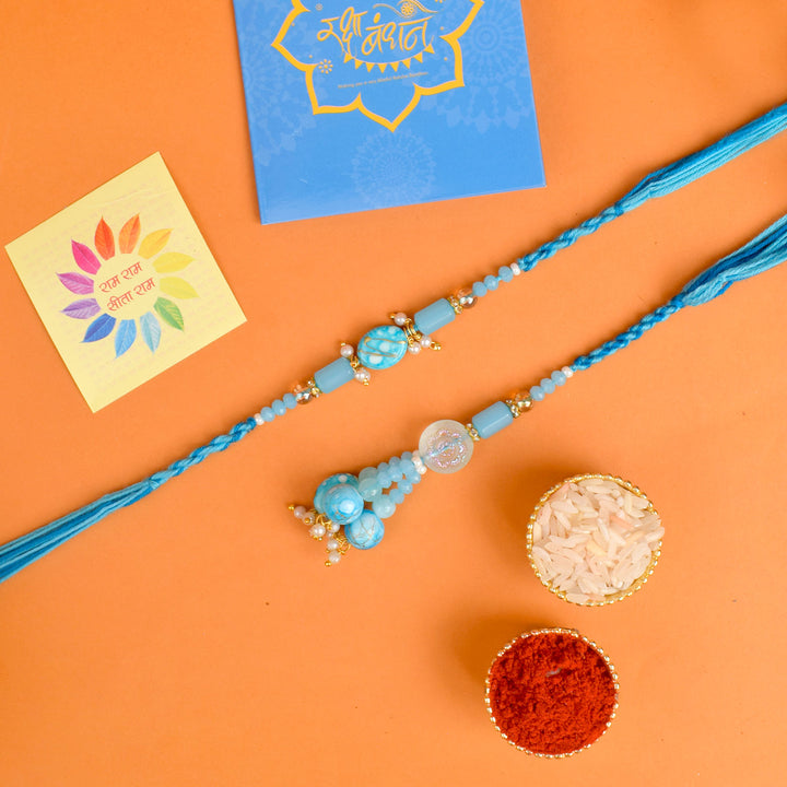 Designer Couple Rakhi Set for Bhaiya and Bhabhi with Roli Chawal and Ram Sita Stickers – Raksha Bandhan Gift Combo. India’s Largest Brass Idols Brand - www.satvikworld.com