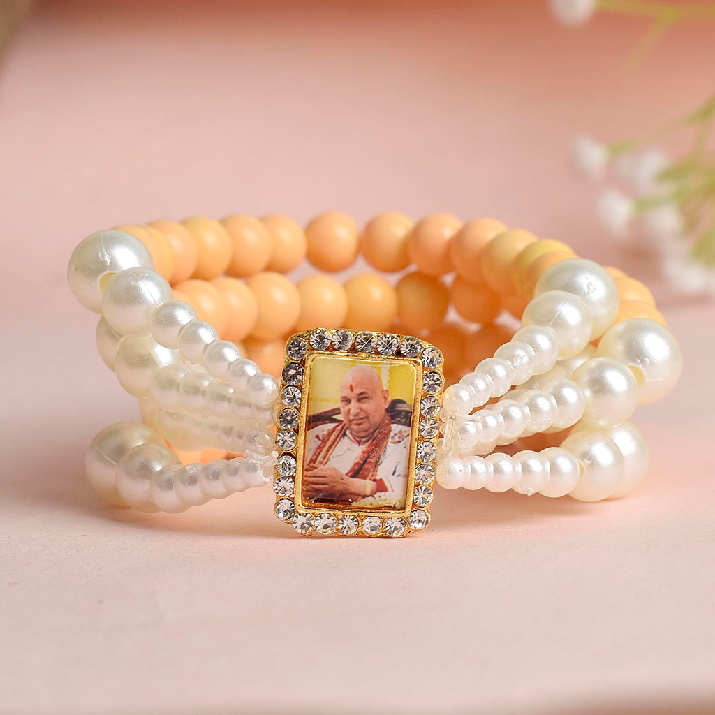 Pastel Yellow & White Pearl Four Layer Guruji Swaroop Bracelet featuring soft pastel yellow beads and luminous white pearls with Jai Guruji Swaroop – perfect for spiritual wear, festive gifting, and daily devotion. India’s Largest Pooja Accessories Brand – www.satvikworld.com

