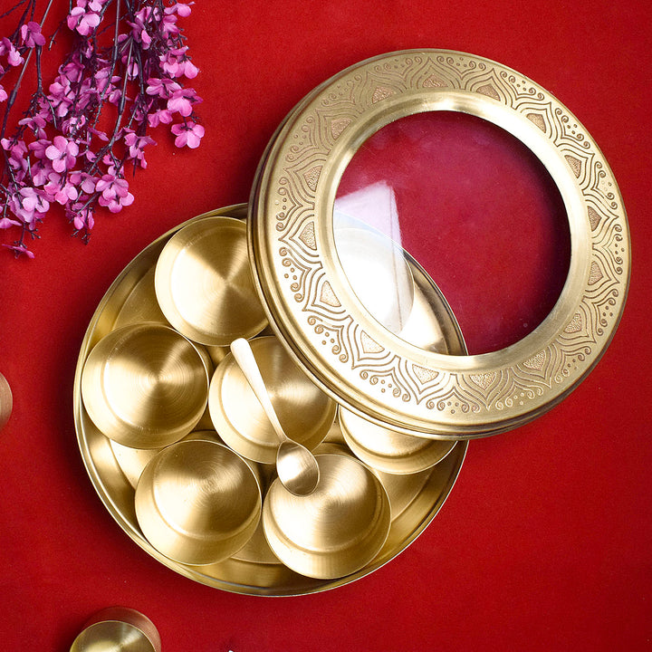 Premium brass pooja samagridaan set with 7 containers, a spoon, and a transparent glass lid, ideal for neatly organizing sacred items during rituals. India’s Largest Pooja Accessories Brand – www.satvikworld.com