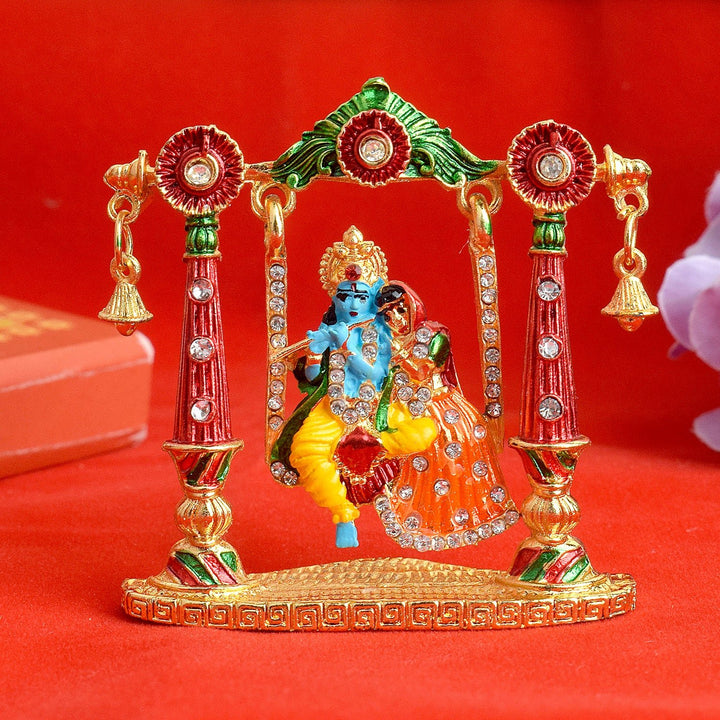 Beautiful Radha Krishna Idol seated on a decorative swing, symbolizing divine love and perfect for home temple or gifting. India’s Largest Pooja Accessories Brand – www.satvikworld.com
