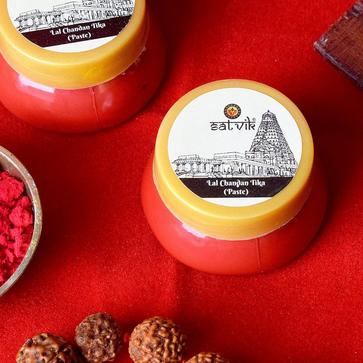 Red Chandan Tikka Paste (Lal Tilak), a sacred and vibrant paste made from red sandalwood, used for applying tilak during religious ceremonies, poojas, and spiritual rituals. India’s Largest Pooja Accessories Brand – www.satvikworld.com