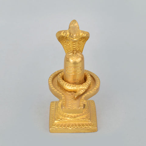 3.3-inch handcrafted brass Shivlingam with intricately designed Nag (serpent) surrounding the base, symbolizing divine energy and protection. The idol features detailed craftsmanship, ideal for worship, spiritual practices, or decorative display. India’s Largest Pooja Accessories Brand- www.satvikworld.com