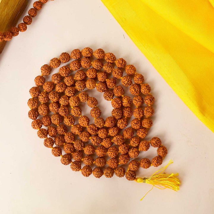Certified natural brown Rudraksha mala with spiritual beads for mantra chanting and meditation. India’s Premium Rudraksha Jap Mala Store- www.satvikworld.com
