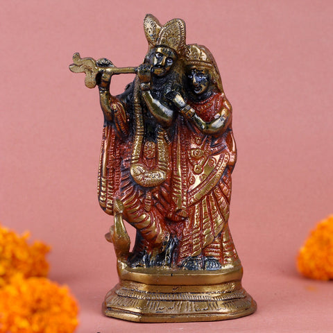 Colorful brass Radha Krishna idol featuring the divine couple in a graceful standing posture, adorned with intricate designs and vibrant hues. India’s Largest Pooja Accessories Brand – www.satvikworld.com