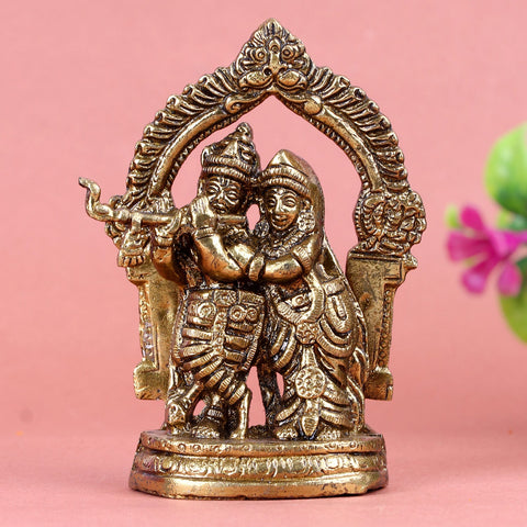 Brass Radha Krishna idol, beautifully crafted with intricate details, depicting Lord Krishna and Radha in a divine and loving embrace, symbolizing love, devotion, and spiritual harmony. Ideal for worship or home décor. India’s Largest Pooja Accessories Brand – www.satvikworld.com
