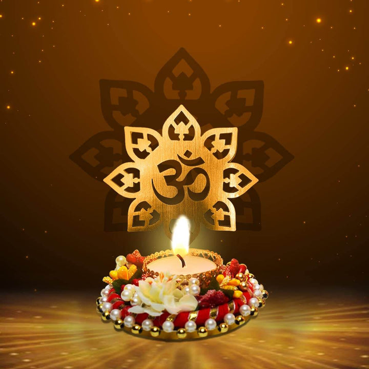 Beautiful Decorative OM Shadow Diya crafted from metal, featuring a glowing OM symbol projection when lit, ideal for spiritual ambiance during pooja, meditation, and festive decor. India’s Largest Pooja Accessories Brand – www.satvikworld.com
