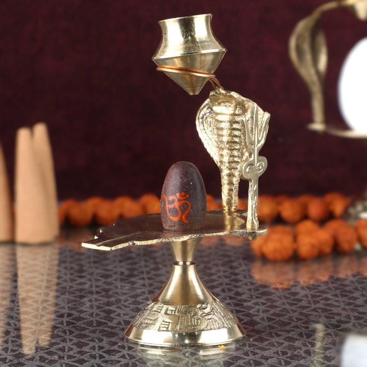 Small pure brass Narmadeshwar Shivling with sacred yoni base, ideal for pooja and divine blessings. India’s Largest Pooja Accessories Brand – www.satvikworld.com